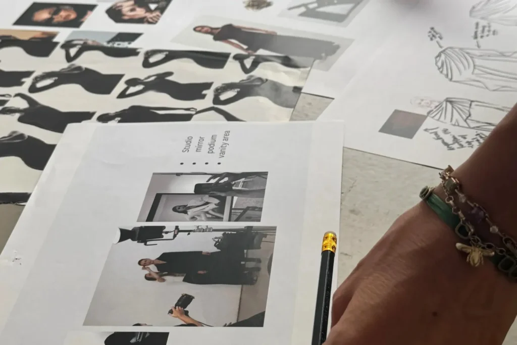 Fashion lookbook planning process with printed mood boards, model references, garment sketches, styling concepts, accessories, and photoshoot inspiration